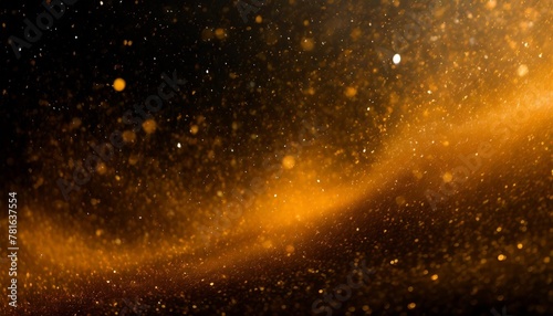 particules scintillantes et brillantes volant sur fond sombre noir lumiere orangee etoile paillette doree et flou cosmos univers espace fond pour banniere conception et creation graphique photo