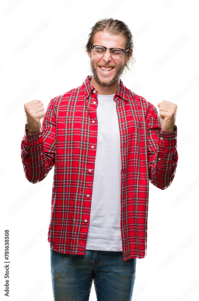 Young handsome man with long hair wearing glasses over isolated background very happy and excited doing winner gesture with arms raised, smiling and screaming for success. Celebration concept. Young handsome man with long hair wearing glasses over isolated background very happy and excited doing winner gesture with arms raised, smiling and screaming for success. Celebration concept.
