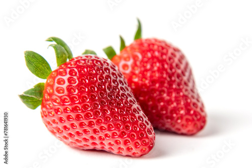 Wallpaper Mural Two Fresh Strawberries Isolated on White. A pair of vibrant, ripe red strawberries with green stems are clearly presented on a clean white background, highlighting their fresh appeal. Torontodigital.ca