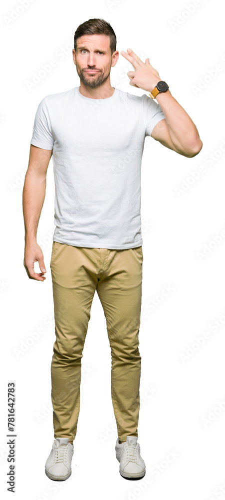 Handsome man wearing casual white t-shirt Shooting and killing oneself pointing hand and fingers to head, suicide gesture. Handsome man wearing casual white t-shirt Shooting and killing oneself pointing hand and fingers to head, suicide gesture.
