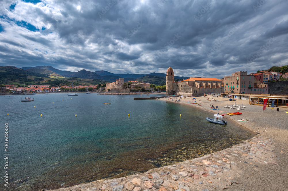 The beach and the lighthouse of  Collioure, France