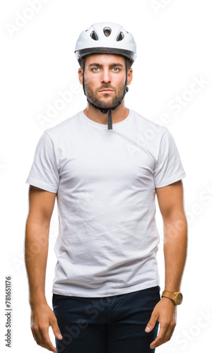 Young handsome man wearing cyclist safety helmet over isolated background with serious expression on face. Simple and natural looking at the camera.