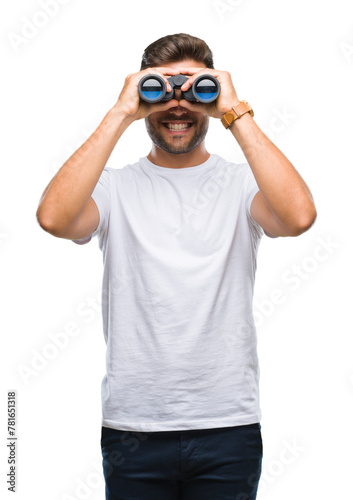 Young handsome man looking through binoculars over isolated background with a happy face standing and smiling with a confident smile showing teeth