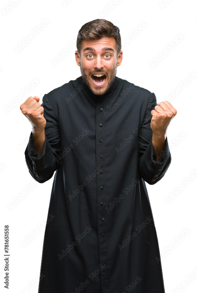 Young catholic christian priest man over isolated background celebrating surprised and amazed for success with arms raised and open eyes. Winner concept. Young catholic christian priest man over isolated background celebrating surprised and amazed for success with arms raised and open eyes. Winner concept.