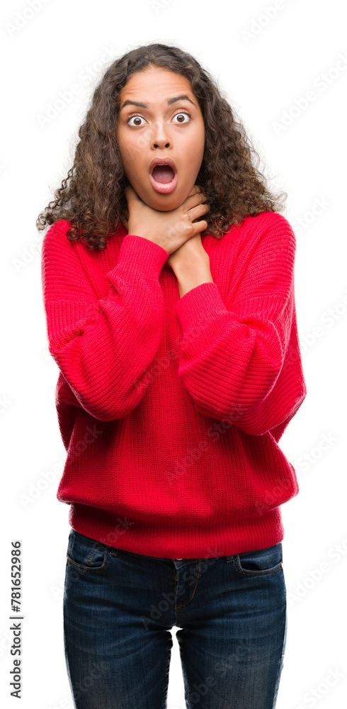 Young hispanic woman wearing red sweater shouting and suffocate because painful strangle. Health problem. Asphyxiate and suicide concept. Young hispanic woman wearing red sweater shouting and suffocate because painful strangle. Health problem. Asphyxiate and suicide concept.