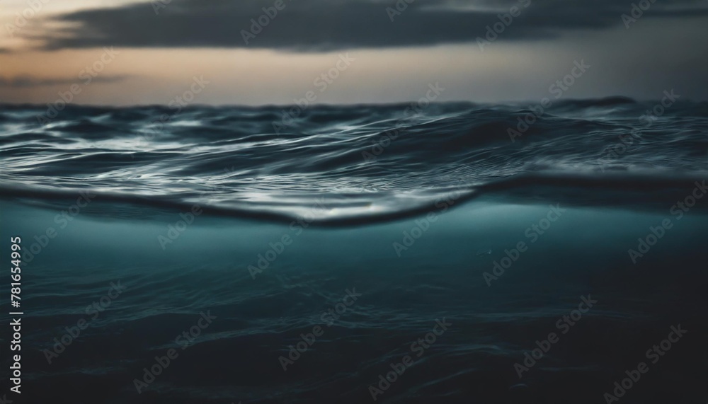 blue sea or ocean water surface and underwater against sunset