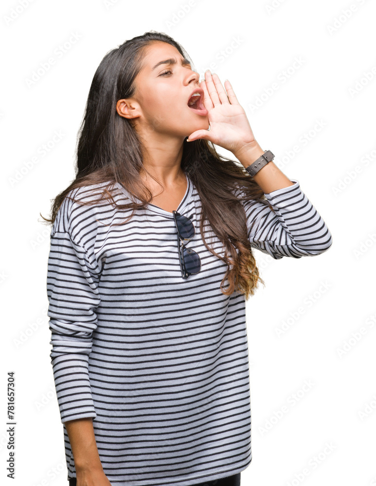 Young beautiful arab woman wearing sunglasses over isolated background shouting and screaming loud to side with hand on mouth. Communication concept. Young beautiful arab woman wearing sunglasses over isolated background shouting and screaming loud to side with hand on mouth. Communication concept.