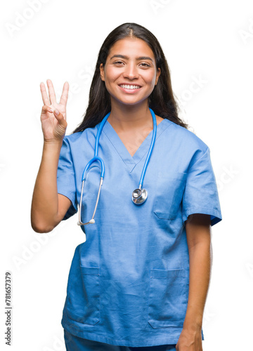 Young arab doctor surgeon woman over isolated background showing and pointing up with fingers number three while smiling confident and happy.