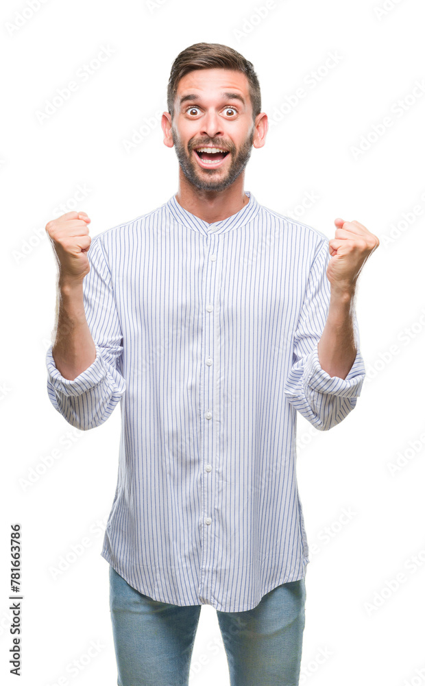 Young handsome man over isolated background celebrating surprised and amazed for success with arms raised and open eyes. Winner concept. Young handsome man over isolated background celebrating surprised and amazed for success with arms raised and open eyes. Winner concept.