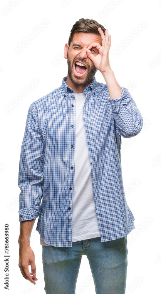 Young handsome man wearing white t-shirt over isolated background doing ok gesture shocked with surprised face, eye looking through fingers. Unbelieving expression. Young handsome man wearing white t-shirt over isolated background doing ok gesture shocked with surprised face, eye looking through fingers. Unbelieving expression.