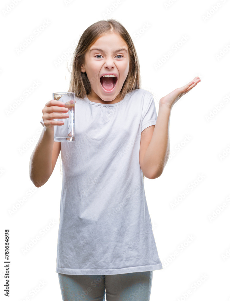 Young beautiful girl drinking glass of water over isolated background very happy and excited, winner expression celebrating victory screaming with big smile and raised hands Young beautiful girl drinking glass of water over isolated background very happy and excited, winner expression celebrating victory screaming with big smile and raised hands