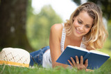 beautiful girl reading a book outdoor