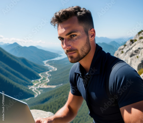 Close-up of a digital nomad working from a mountaintop, laptop on lap and breathtaking view in the background. AI generated.