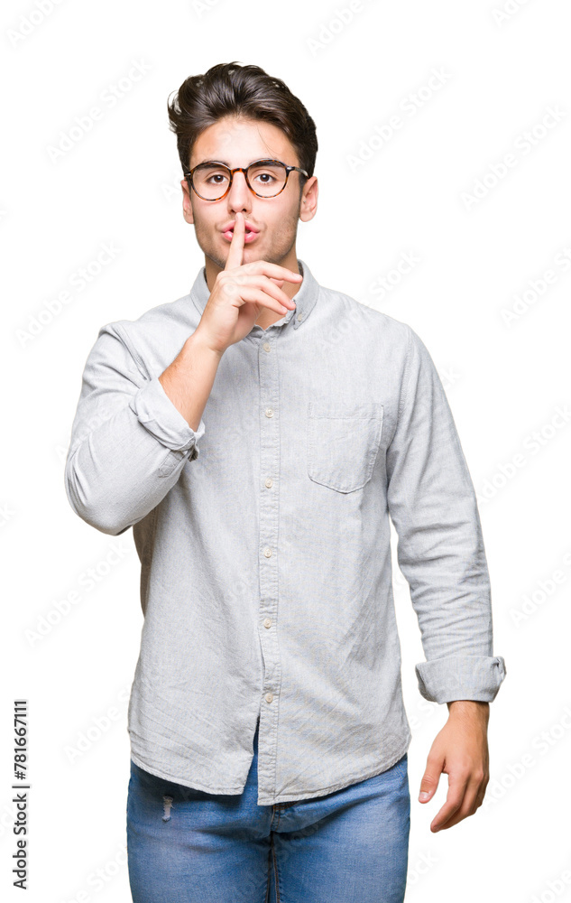 Young handsome man wearing glasses over isolated background asking to be quiet with finger on lips. Silence and secret concept. Young handsome man wearing glasses over isolated background asking to be quiet with finger on lips. Silence and secret concept.