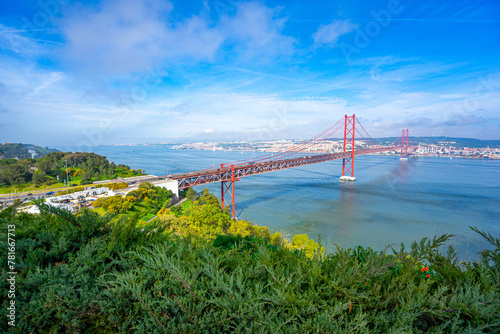 25 de Abril bridge, or Salazar bridge seen from Almada to Lisbon-Portugal. photo