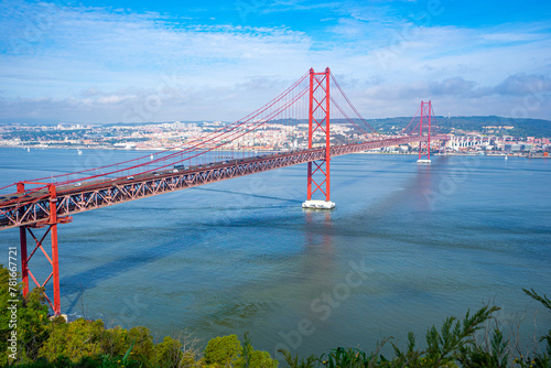 25 de Abril bridge, or Salazar bridge seen from Almada to Lisbon-Portugal. photo