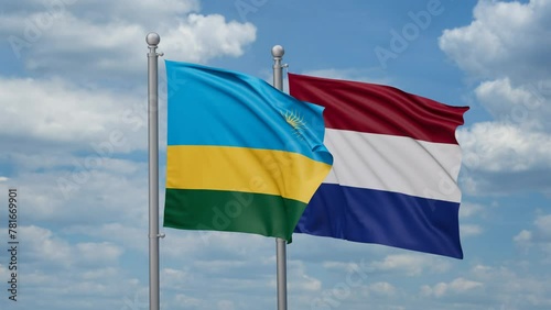 Netherlands and Rwanda two flags waving together, looped video, two country relations concept photo