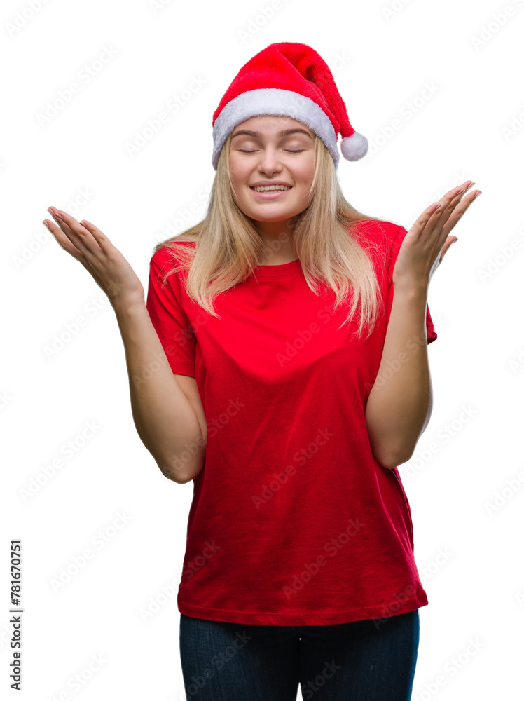 Young caucasian woman wearing christmas hat over isolated background celebrating mad and crazy for success with arms raised and closed eyes screaming excited. Winner concept Young caucasian woman wearing christmas hat over isolated background celebrating mad and crazy for success with arms raised and closed eyes screaming excited. Winner concept