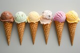 Assorted ice cream cones on a light background