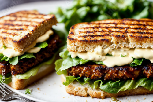 Macro shot of barbecue tempeh sandwiches with a drizzle of vegan mayonnaise and fresh greens, emphasizing the creamy and crisp textures. AI generated.