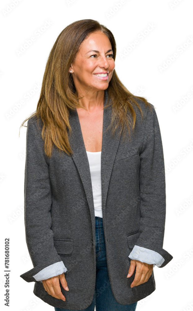 Middle age adult woman wearing oversize boyfriend jacket over isolated background looking away to side with smile on face, natural expression. Laughing confident.