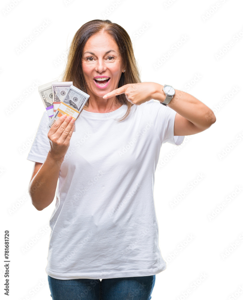 Middle age hispanic woman holding bunch of dollars over isolated background very happy pointing with hand and finger Middle age hispanic woman holding bunch of dollars over isolated background very happy pointing with hand and finger