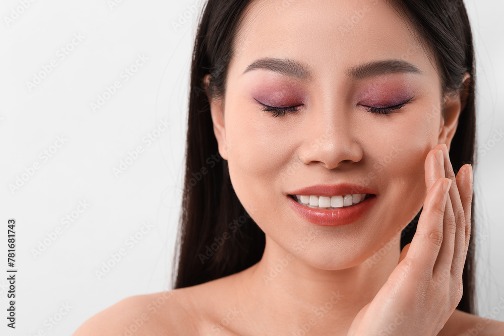 Portrait of beautiful woman on white background