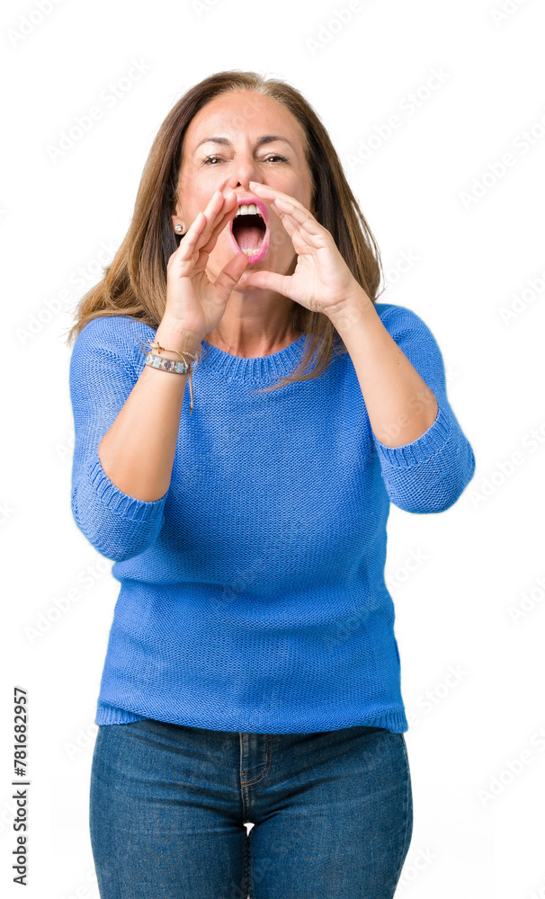 Middle age beautiful woman wearing winter sweater over isolated background Shouting angry out loud with hands over mouth Middle age beautiful woman wearing winter sweater over isolated background Shouting angry out loud with hands over mouth