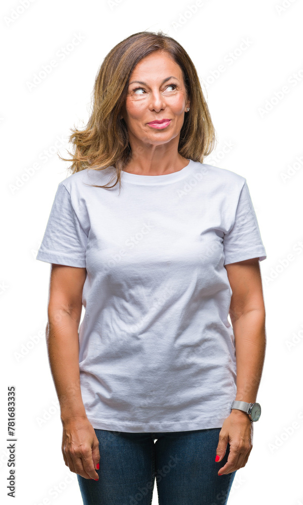 Middle age senior hispanic woman over isolated background smiling looking side and staring away thinking.