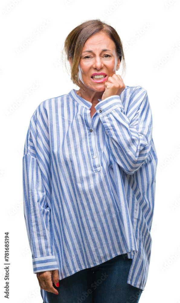 Middle age senior hispanic woman over isolated background looking stressed and nervous with hands on mouth biting nails. Anxiety problem. Middle age senior hispanic woman over isolated background looking stressed and nervous with hands on mouth biting nails. Anxiety problem.
