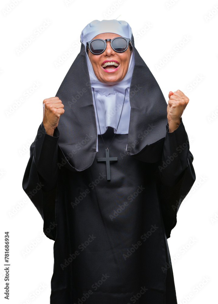 Middle age senior catholic nun woman wearing sunglasses over isolated background celebrating surprised and amazed for success with arms raised and open eyes. Winner concept. Middle age senior catholic nun woman wearing sunglasses over isolated background celebrating surprised and amazed for success with arms raised and open eyes. Winner concept.