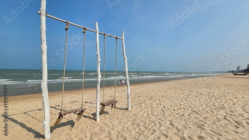 seaside swing, swing on the beach with sea wave background, relax by the sea, romantic