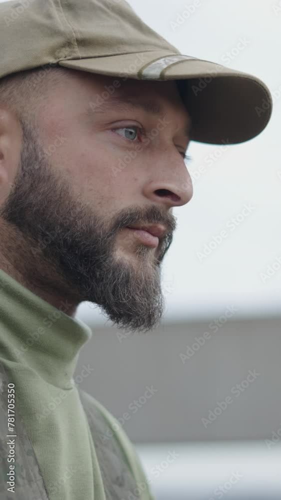 A blue eyed hunter observes something in the bush A blue eyed hunter observes something in the bush