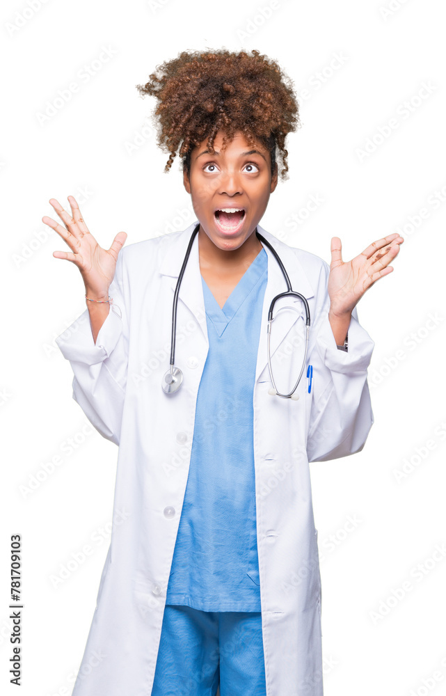 Young african american doctor woman over isolated background celebrating crazy and amazed for success with arms raised and open eyes screaming excited. Winner concept Young african american doctor woman over isolated background celebrating crazy and amazed for success with arms raised and open eyes screaming excited. Winner concept