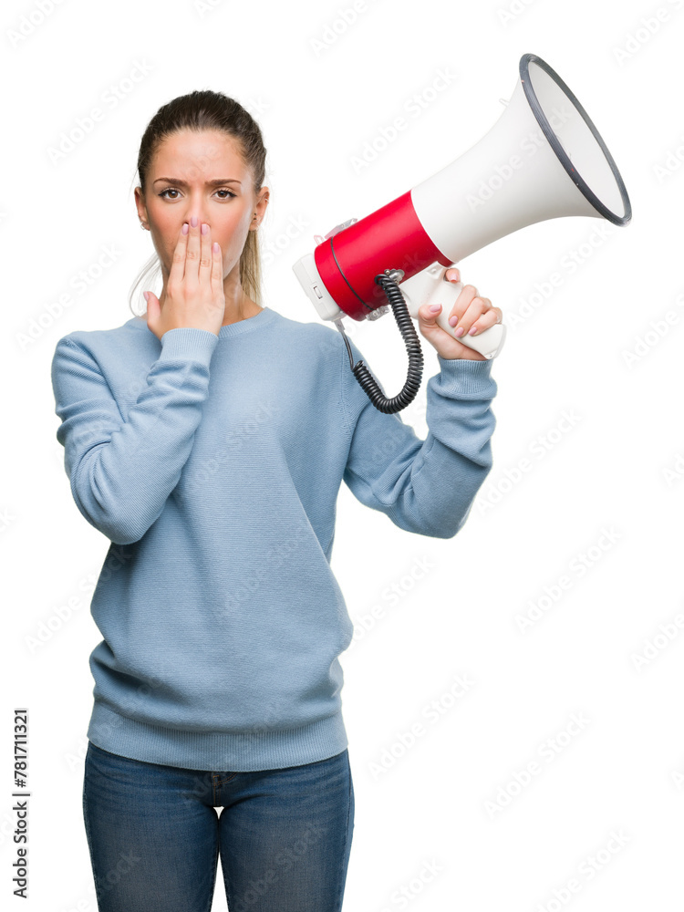 Beautiful young woman holding megaphone cover mouth with hand shocked with shame for mistake, expression of fear, scared in silence, secret concept Beautiful young woman holding megaphone cover mouth with hand shocked with shame for mistake, expression of fear, scared in silence, secret concept
