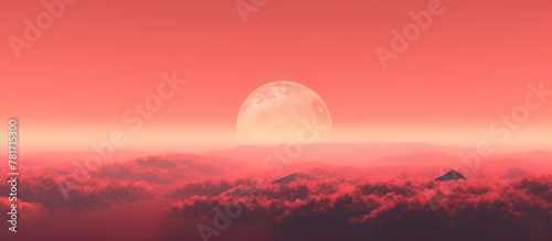 misty mountains against a red,orange sunset sky photo