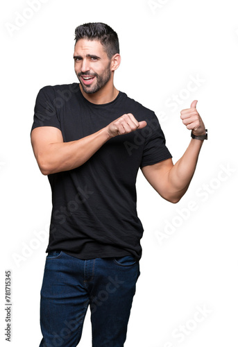 Young handsome man over isolated background Pointing to the back behind with hand and thumbs up, smiling confident photo