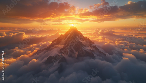 The sun crests over a majestic mountain peak, illuminating a clouds under a dramatic golden sunrise
