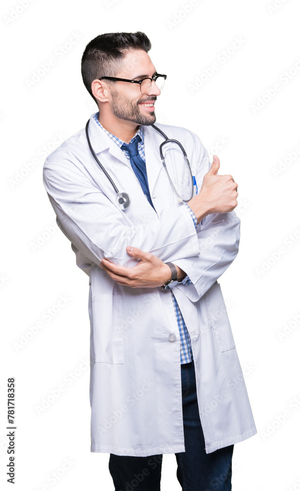 Handsome young doctor man over isolated background Looking proud, smiling doing thumbs up gesture to the side Handsome young doctor man over isolated background Looking proud, smiling doing thumbs up gesture to the side