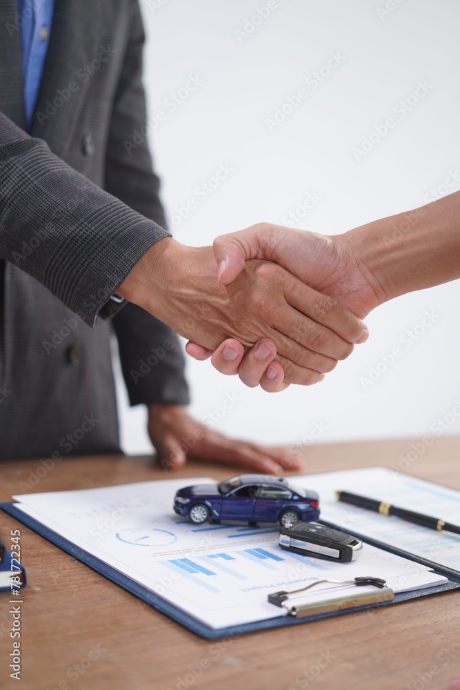 Agent Assurance Securing Deals with Confidence close up man working with car contract document or lease paper at desk in loan car office. Agent Assurance Securing Deals with Confidence close up man working with car contract document or lease paper at desk in loan car office.