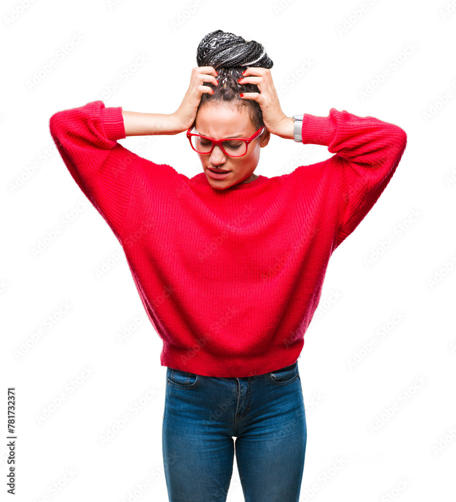 Fototapeta premium Young braided hair african american girl wearing sweater and glasses over isolated background suffering from headache desperate and stressed because pain and migraine. Hands on head.