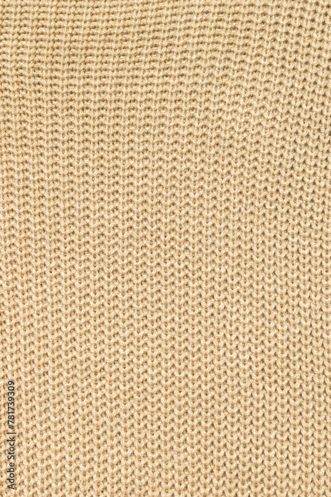 Background of light beige knitted fabric.