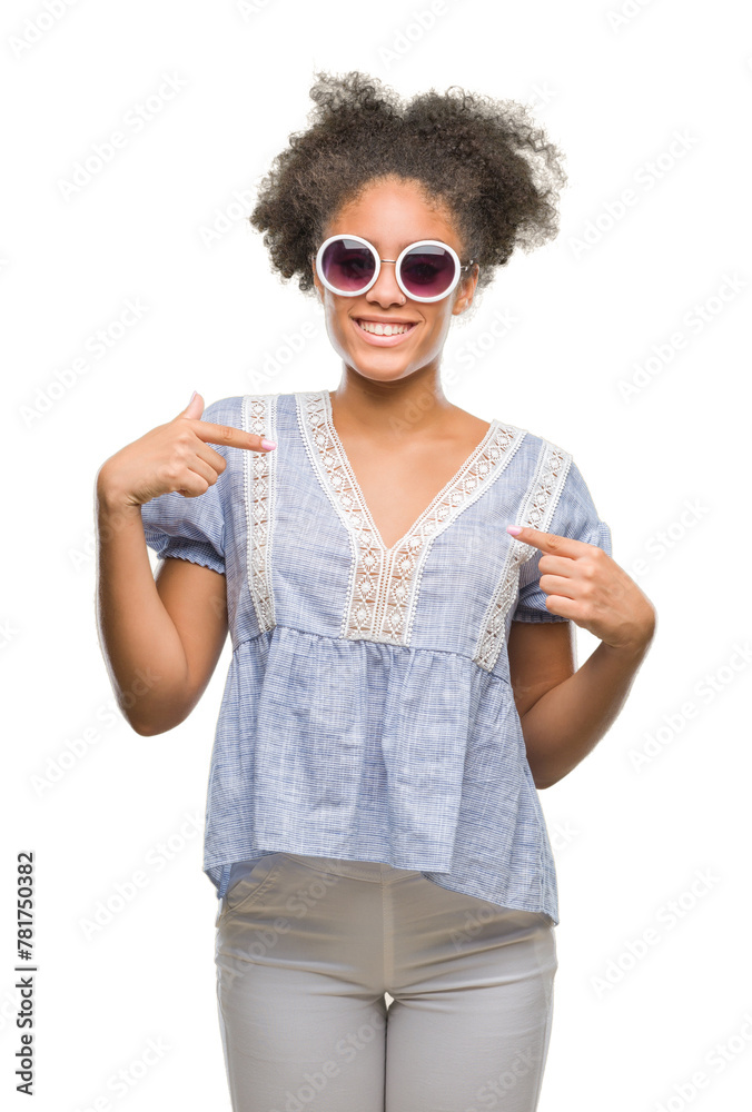 Young afro american woman wearing glasses over isolated background looking confident with smile on face, pointing oneself with fingers proud and happy. Young afro american woman wearing glasses over isolated background looking confident with smile on face, pointing oneself with fingers proud and happy.