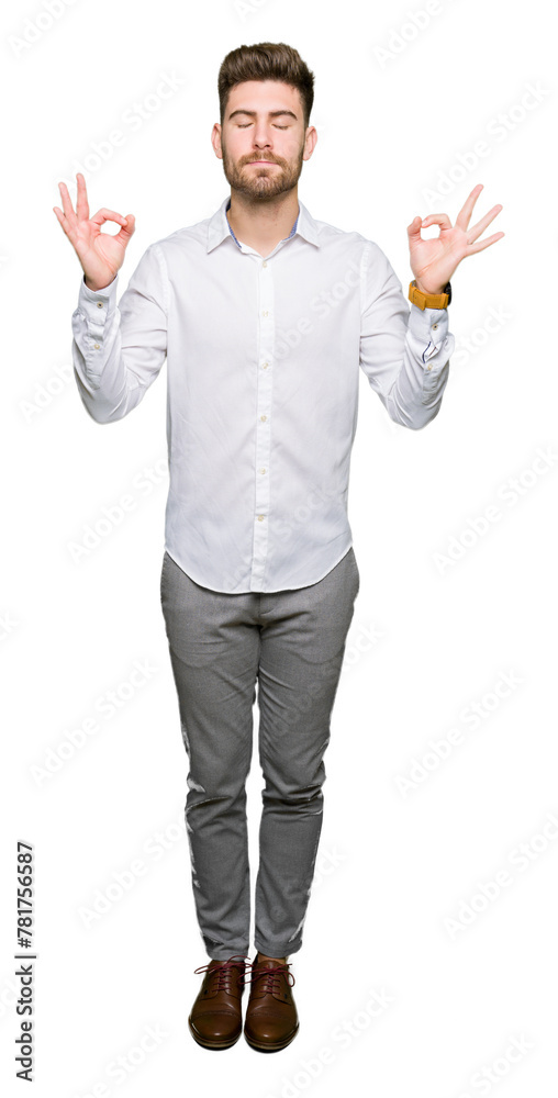 Young handsome business man relax and smiling with eyes closed doing meditation gesture with fingers. Yoga concept. Young handsome business man relax and smiling with eyes closed doing meditation gesture with fingers. Yoga concept.