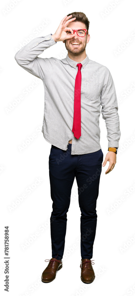 Young handsome business man wearing glasses doing ok gesture with hand smiling, eye looking through fingers with happy face. Young handsome business man wearing glasses doing ok gesture with hand smiling, eye looking through fingers with happy face.