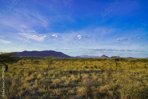 Samburu is a big sky country with vast dry grass plains dotted with rolling hills seen in this spectacular view at the Buffalo Springs Reserve in Samburu County, Kenya photo