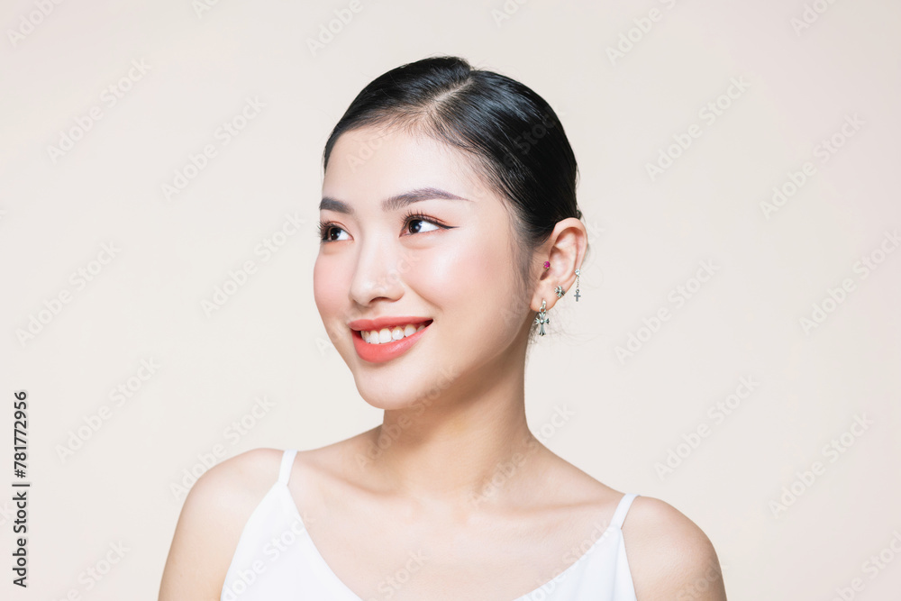 Young asian beauty woman touch clean beautiful healthy face, isolated on beige background Young asian beauty woman touch clean beautiful healthy face, isolated on beige background