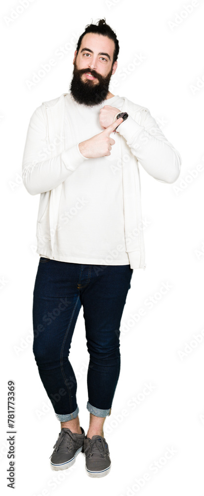 Young hipster man with long hair and beard wearing sporty sweatshirt In hurry pointing to watch time, impatience, upset and angry for deadline delay Young hipster man with long hair and beard wearing sporty sweatshirt In hurry pointing to watch time, impatience, upset and angry for deadline delay