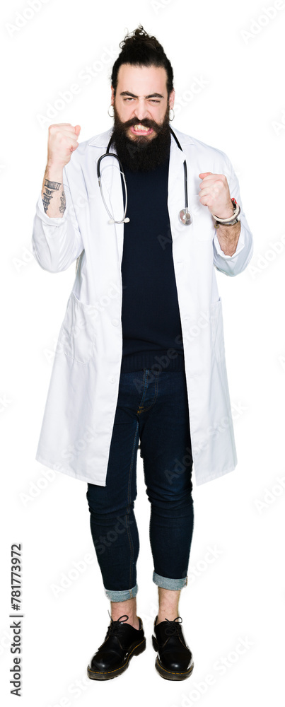 Doctor with long hair wearing medical coat and stethoscope angry and mad raising fist frustrated and furious while shouting with anger. Rage and aggressive concept. Doctor with long hair wearing medical coat and stethoscope angry and mad raising fist frustrated and furious while shouting with anger. Rage and aggressive concept.