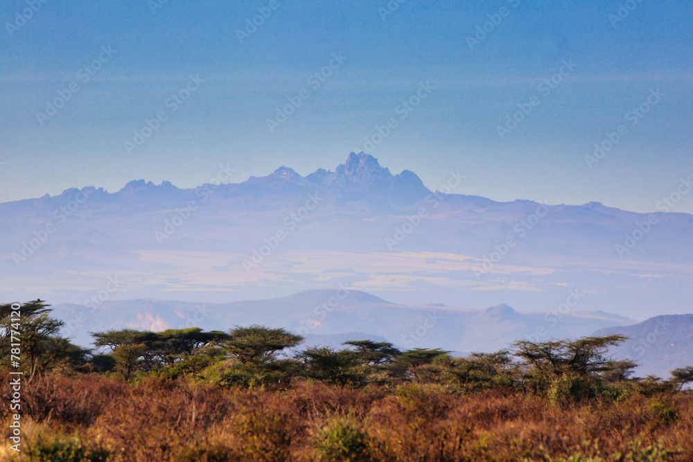 Mount Kenya, thehighest mountain in Kenya at 5199 meters dominates the horizon as seen over the vast samburu region at the Buffalo Springs Reserve in Kenya 